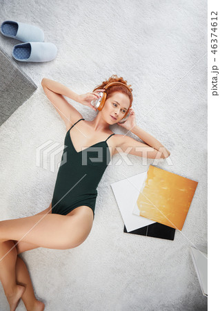 the image of resting sexy woman listening to vinyl 46374612