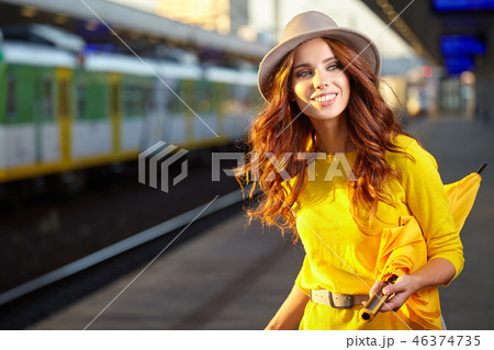 caucasian woman waiting at the railway station caucasian woman waiting at the railway station 46374735