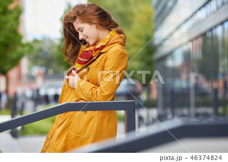 beautiful young woman in autumn city 46374824