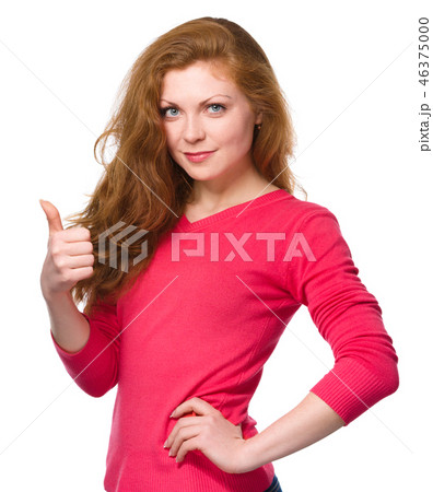 Woman is showing thumb up gesture Woman is showing thumb up gesture 46375000