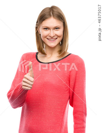 Woman is showing thumb up gesture 46375017