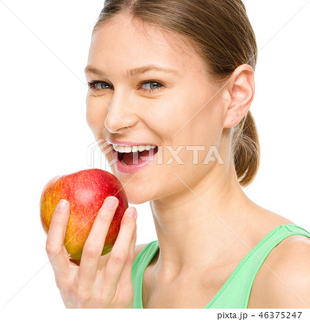 Young happy girl with apple Young happy girl with apple 46375247