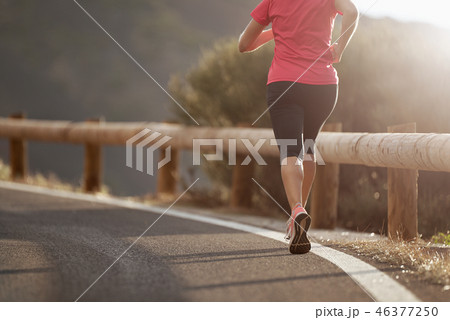 Fitness woman runner athlete running at road 46377250