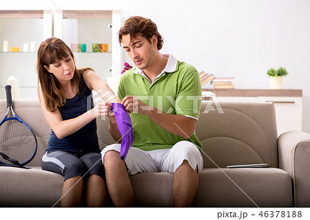 Man and woman discussing elbow strap 46378188