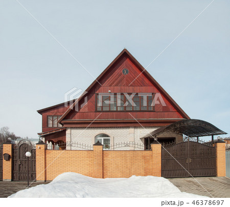 Brick cottage in early spring 46378697