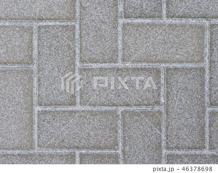 Snowy pavement background 46378698