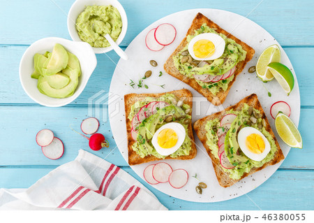 Toasts with avocado guacamole, fresh radish Toasts with avocado guacamole, fresh radish 46380055