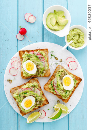 Toasts with avocado guacamole, fresh radish Toasts with avocado guacamole, fresh radish 46380057
