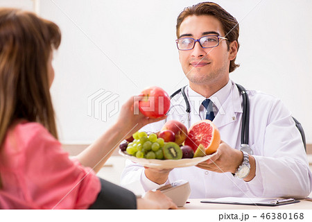 Pregnant woman visiting doctor discussing healthy diet Pregnant woman visiting doctor discussing healthy diet 46380168