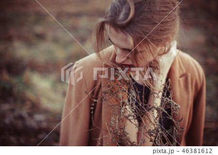 Lonely girl on a walk in the fall field 46381612