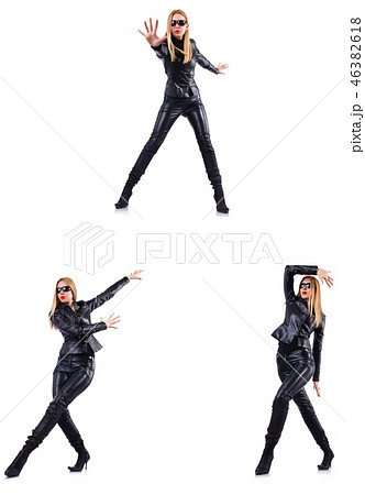 Dancing woman in black leather costume Dancing woman in black leather costume 46382618