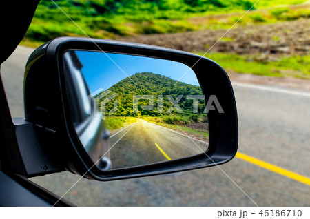 Landscape in the sideview mirror of a car Landscape in the sideview mirror of a car 46386710