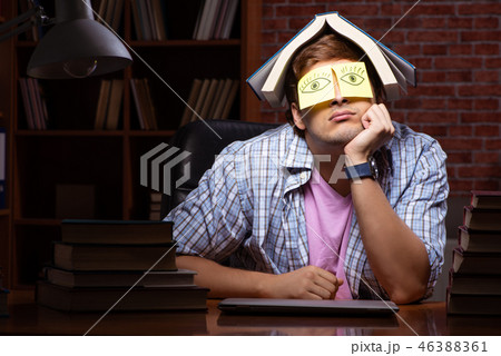 Young handsome student preparing for exams at night  46388361