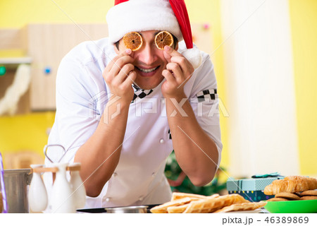 Young chef husband working in kitchen at Christmas eve  46389869