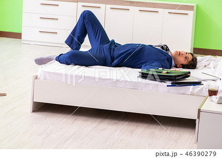 Businessman working overtime in hotel room 46390279