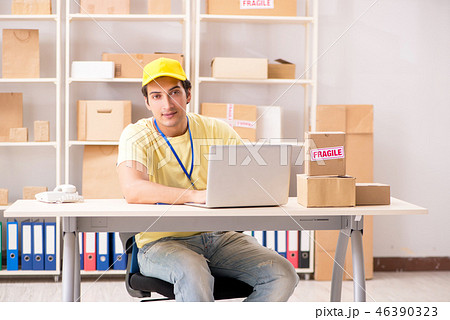 Handsome contractor working in box delivery relocation service Handsome contractor working in box delivery relocation service 46390323