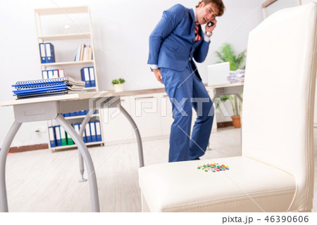 Office prank with sharp thumbtacks on chair Office prank with sharp thumbtacks on chair 46390606