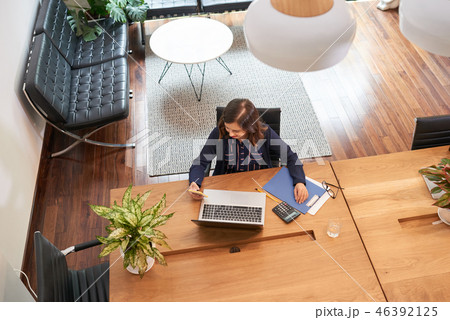 Business lady checking messages Business lady checking messages 46392125