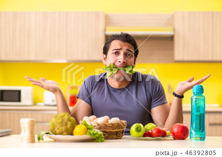 Young man in dieting and healthy eating concept 46392805