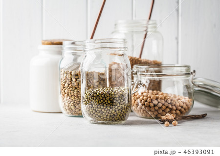 Various legumes in glass jars 46393091
