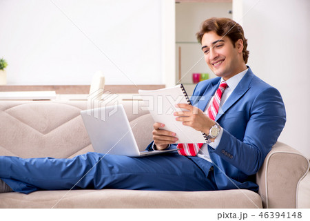 Young businessman working at home sitting on the sofa  46394148
