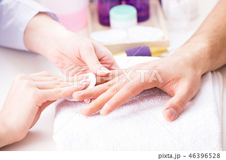 Hands during manicure care session Hands during manicure care session 46396528