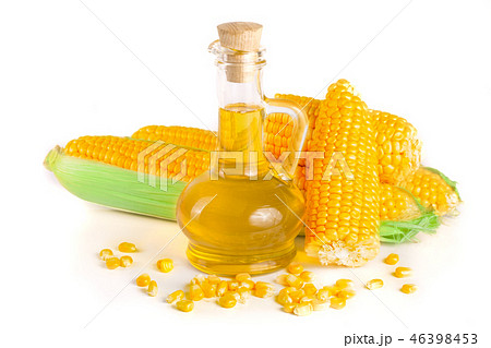 Corn oil in decanter, fresh corn cobs and grains isolated on white background 46398453