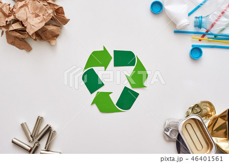 Four types of garbage. Batteries, canns, paper and plastic in the corners Four types of garbage. Batteries, canns, paper and plastic in the corners 46401561