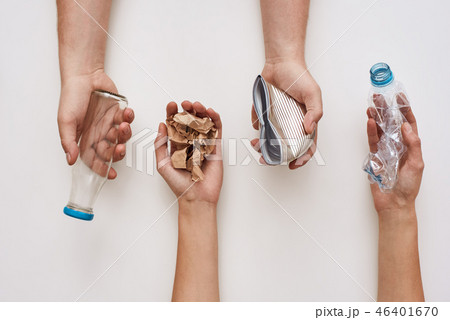 Sparate your trash. Four types of garbage in human hands Sparate your trash. Four types of garbage in human hands 46401670
