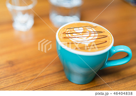 Latte art coffee cup in green glass 46404838
