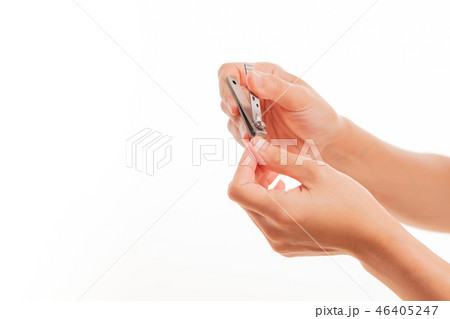 woman hand cutting nails using nail clipper 46405247
