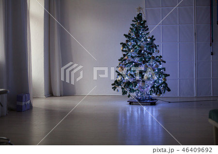 Christmas tree in the Interior of the white room gifts new year holiday Garland lights 46409692