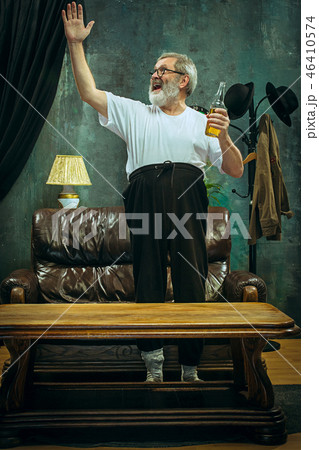 Winner. Overwhelmed cheerful man moving hands while celebrating the victory 46410574