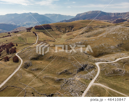 Rural road in unspoiled hills and steppe in Bosnia Rural road in unspoiled hills and steppe in Bosnia 46410847