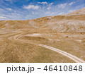 Dirt road in remote Bosnia steppe 46410848