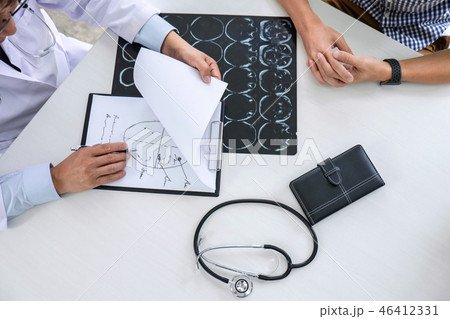 Professor Doctor having conversation with patient and holding x- 46412331