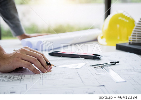 Construction engineering or architect hands working on blueprint 46412334