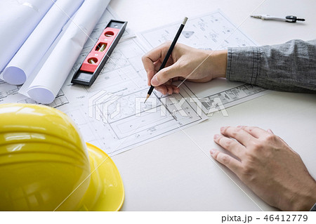 Construction engineering or architect hands working on blueprint Construction engineering or architect hands working on blueprint 46412779