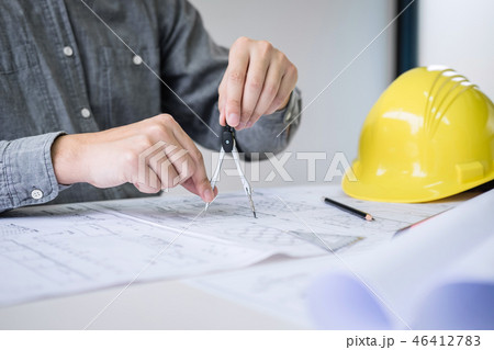 Construction engineering or architect hands working on blueprint Construction engineering or architect hands working on blueprint 46412783