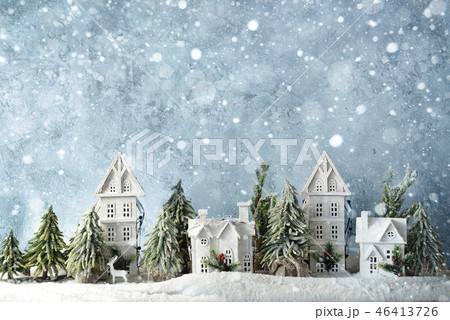 Frosty winter wonderland forest with snowfall, houses and trees. Christmas greetings concept 46413726