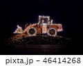 Blurred wheel loader decorated with christmas lights 46414268