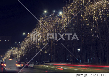 Christmas garland, blurred cars lights and traffic 46415140