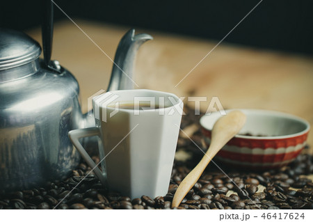 Coffee cup and hot pot. Roasted coffee beans. Coffee cup and hot pot. Roasted coffee beans. 46417624