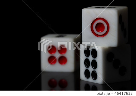 Closeup three dice stacked on dark background. Closeup three dice stacked on dark background. 46417632
