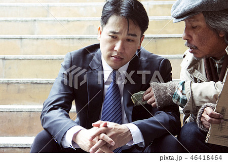 Business man and homeless man on walking street. Business man and homeless man on walking street. 46418464