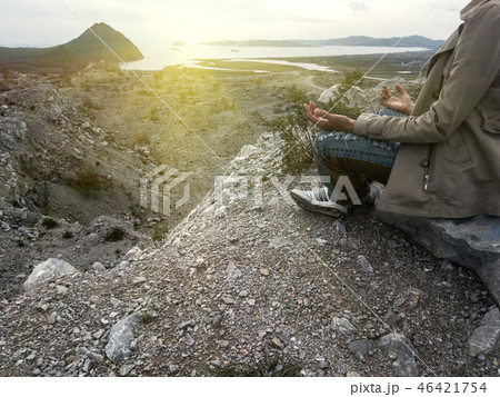 Yoga woman. Yoga poses. Silhouette sitting in lotus position meditating during sunset. 46421754