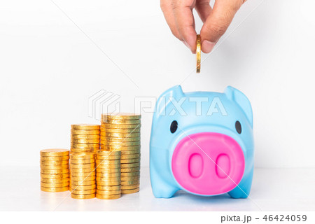Male hand putting coin into blue piggy bank. 46424059
