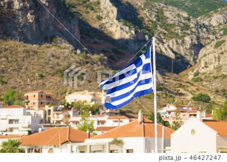 Greek flag against town Greek flag against town 46427247