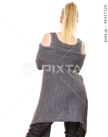 Woman wearing gray long top sweater tunic Woman wearing gray long top sweater tunic 46427326