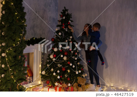 mom with son adorn the Christmas tree Christmas new year gifts mom with son adorn the Christmas tree Christmas new year gifts 46427519